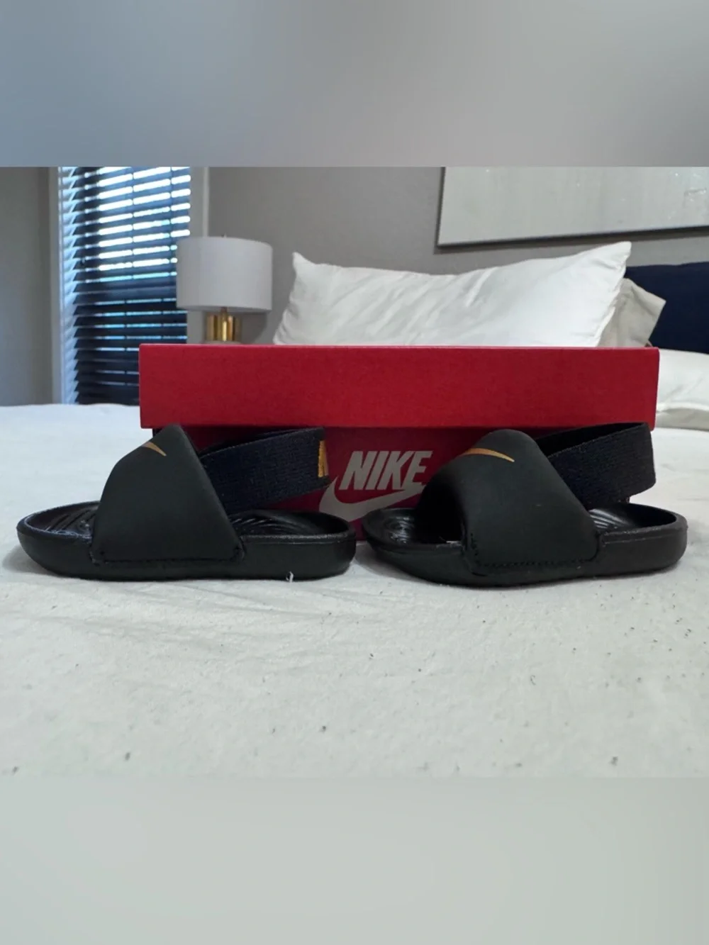 Nike Infant Black Slide Sandals with Gold Swoosh